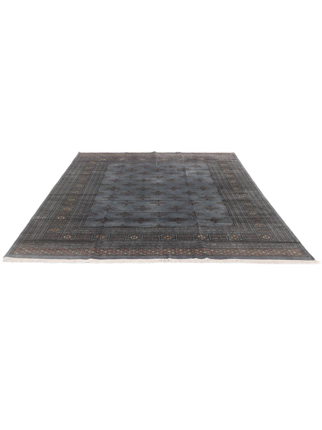 A hand-knotted Pakistan Bokhara 2ply rug with a blue field and repeating motifs.