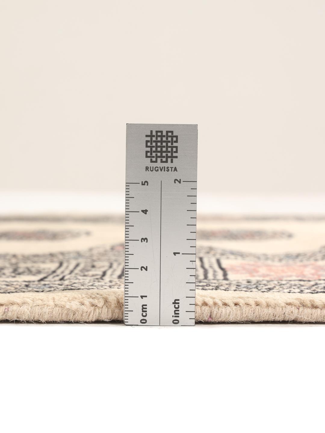 Hand-knotted Pakistan Bokhara runner with beige field and medallion patterns