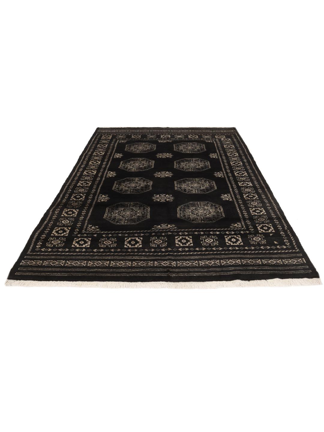 A hand-knotted Pakistan Bokhara rug with a dark field and geometric motifs.