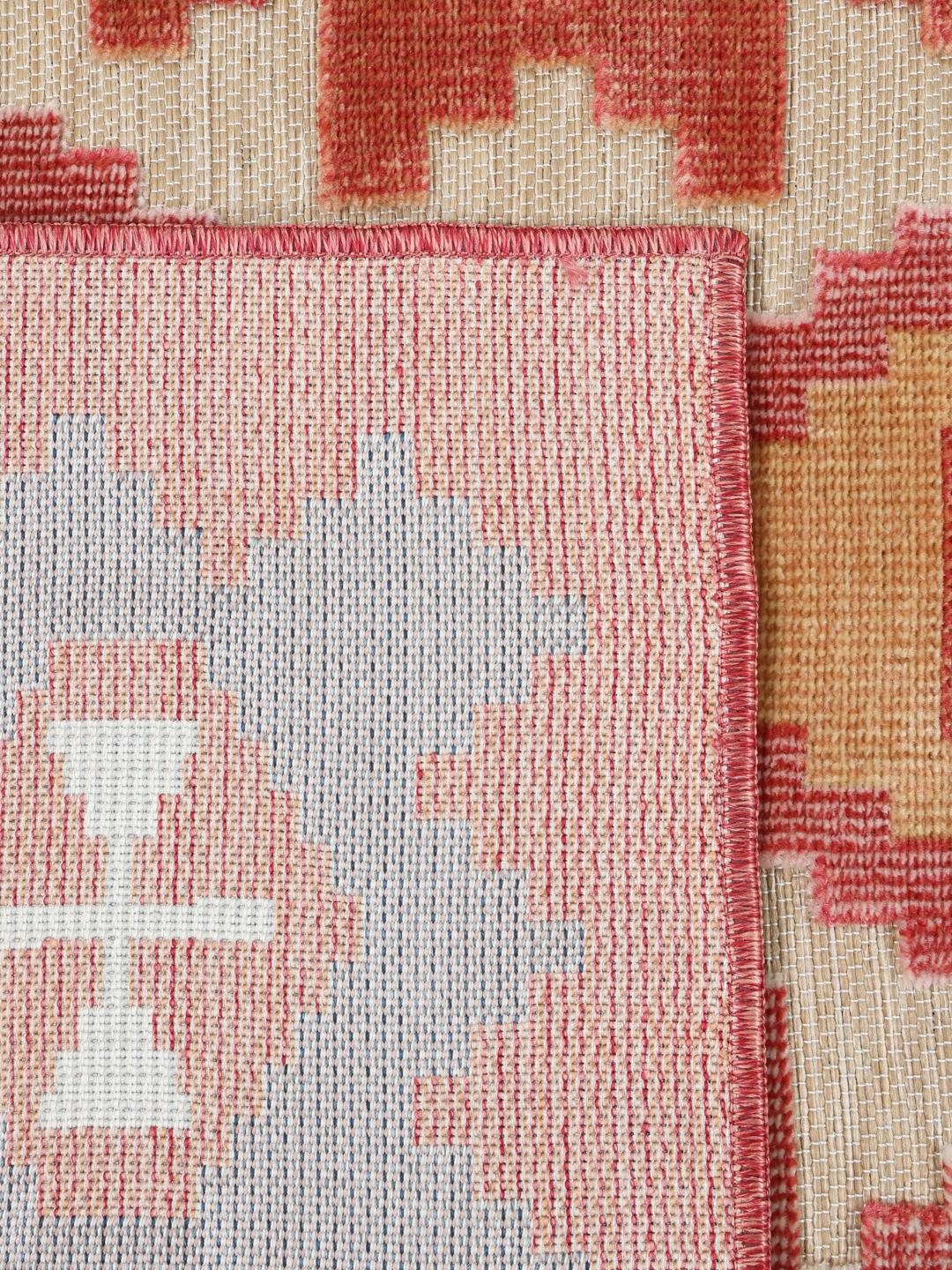 Beige vloerkleed met geometrisch patroon