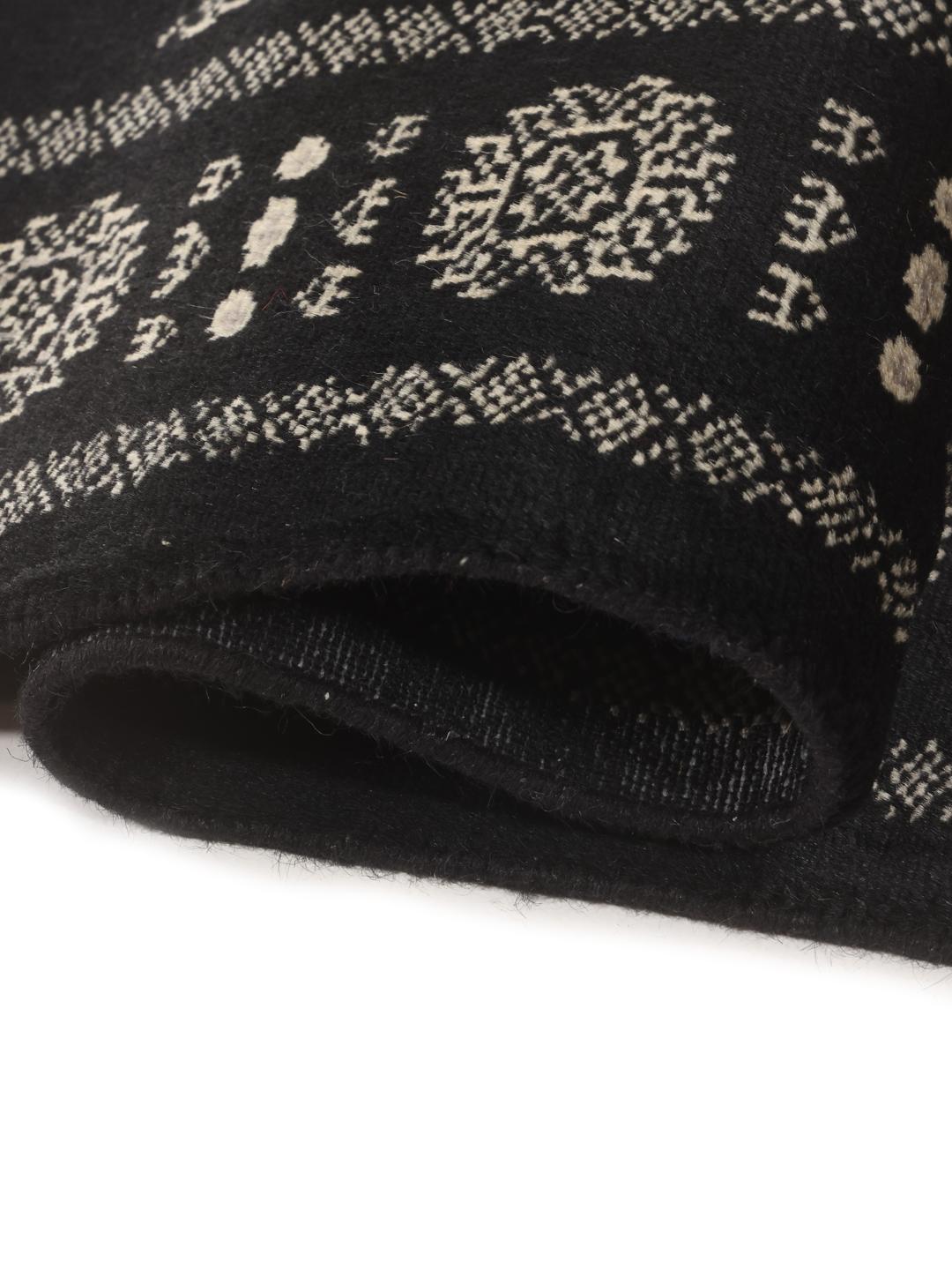 Hand-knotted black runner from Pakistan with traditional geometric patterns