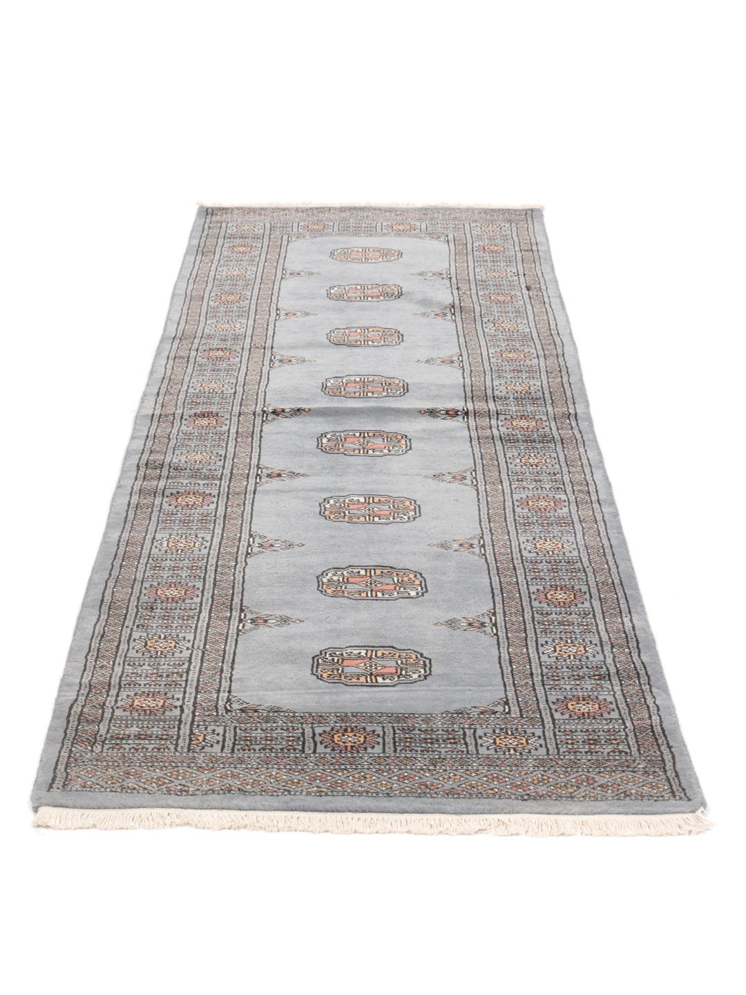 Hand-knotted Pakistan Bokhara runner in blue with traditional motifs