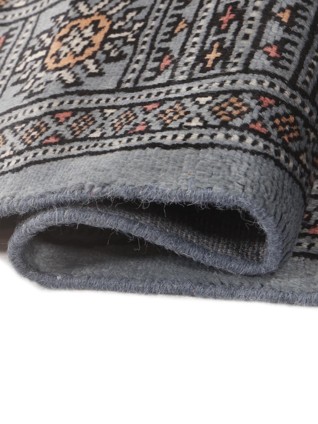 Hand-knotted Pakistan Bokhara runner in blue with traditional motifs