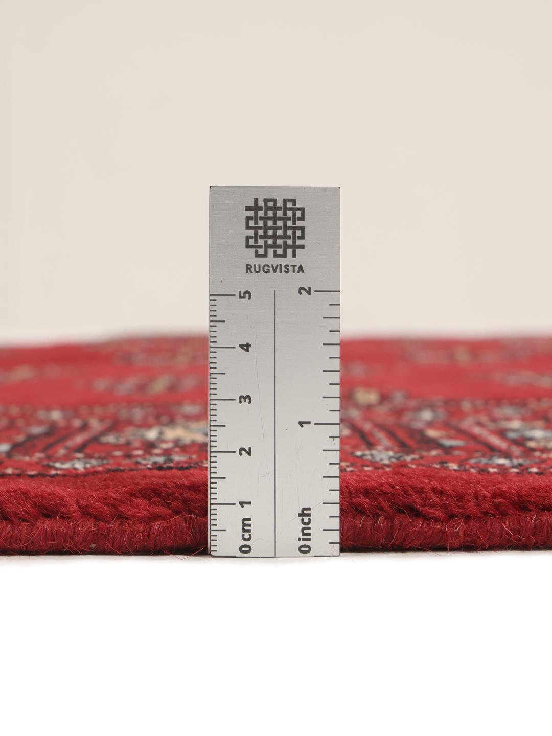 Hand-knotted Pakistan Bokhara 3ply rug in dark-red with traditional motifs