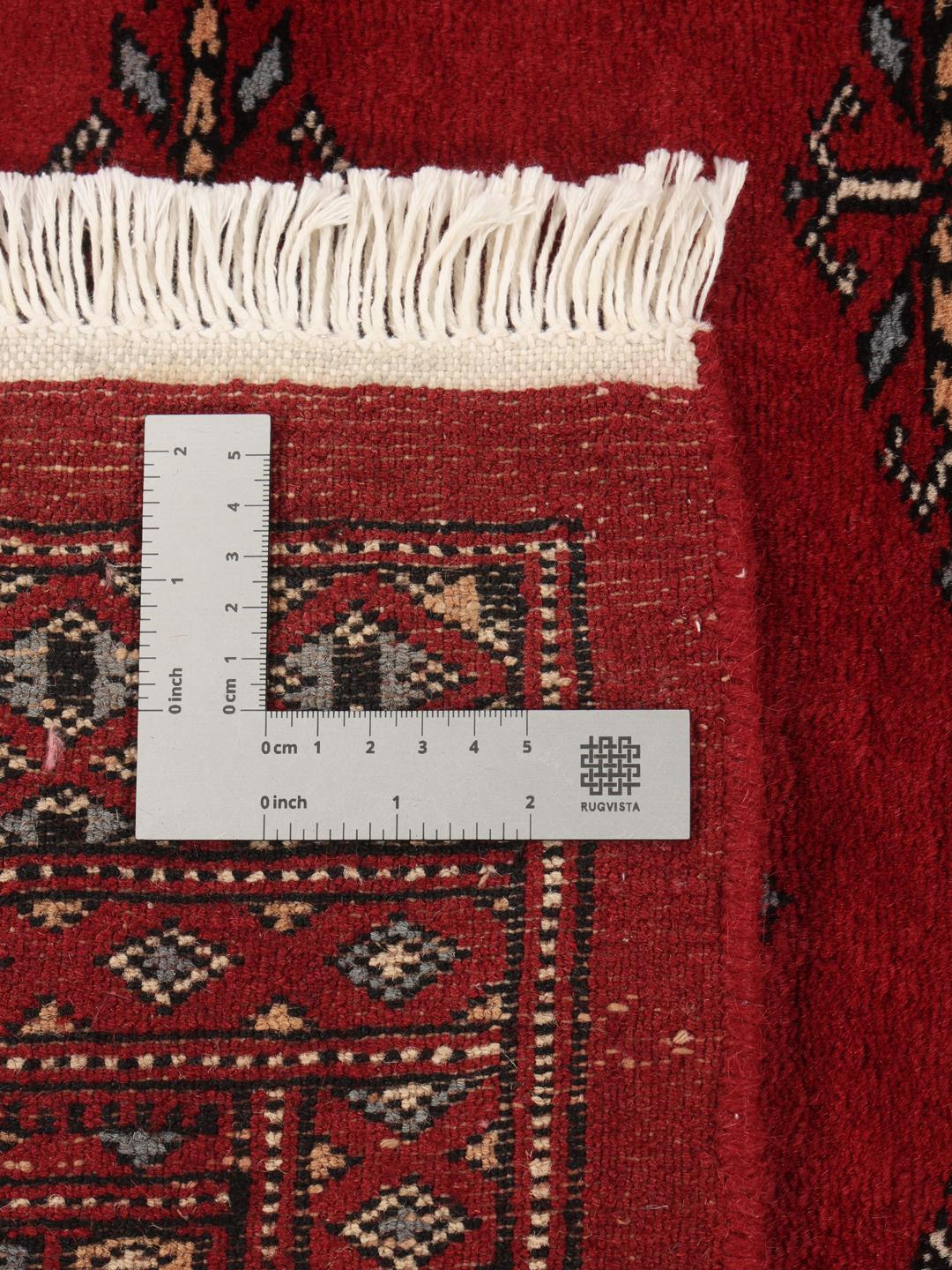 Hand-knotted Pakistan Bokhara 3ply rug in dark-red with traditional motifs