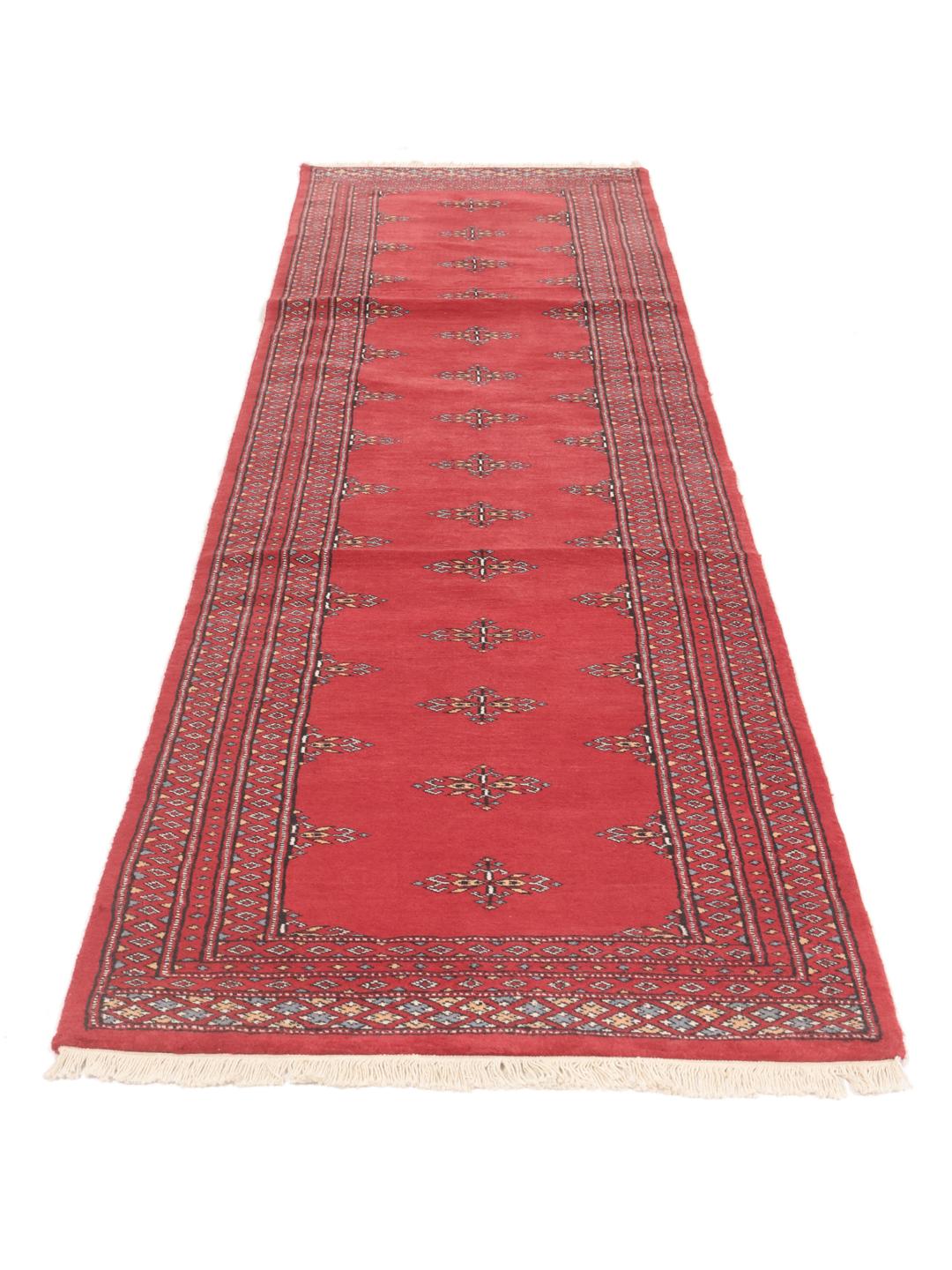Hand-knotted red Pakistan Bokhara runner rug
