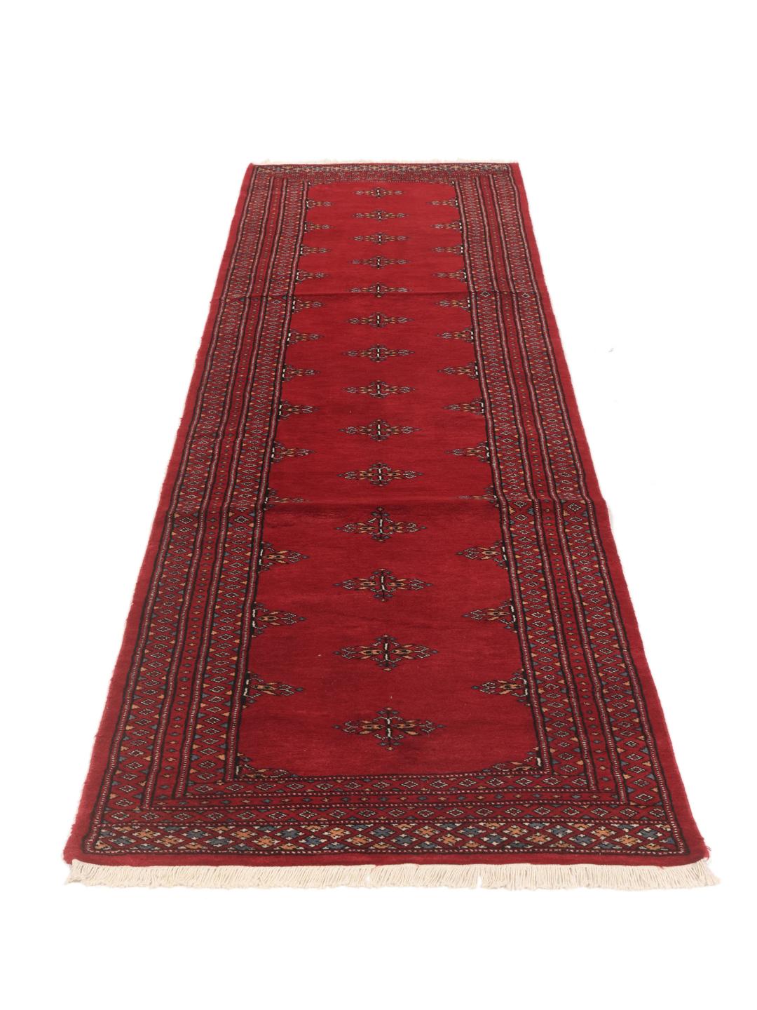 Hand-knotted red Pakistan Bokhara runner rug