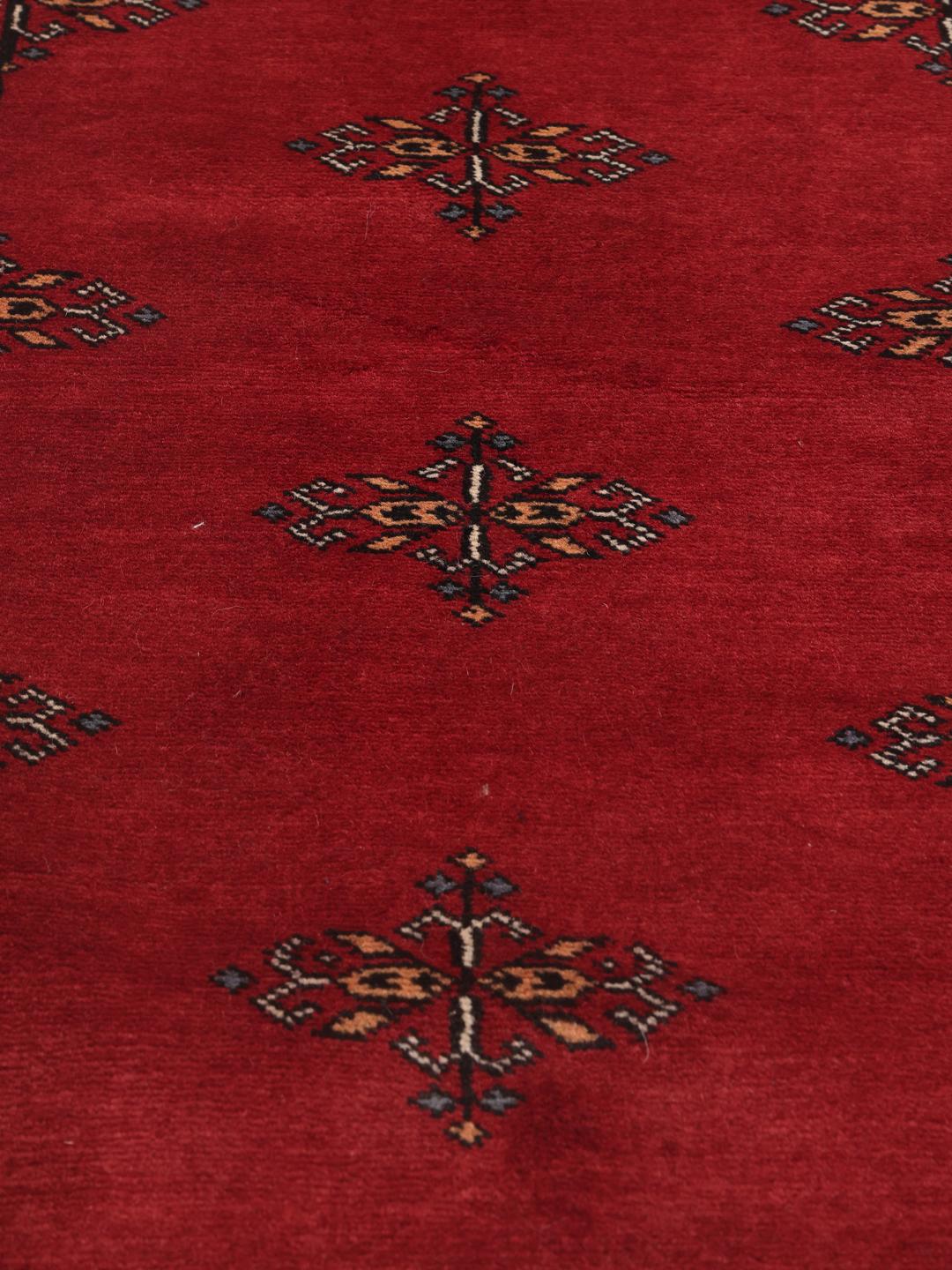 Hand-knotted red Pakistan Bokhara runner rug