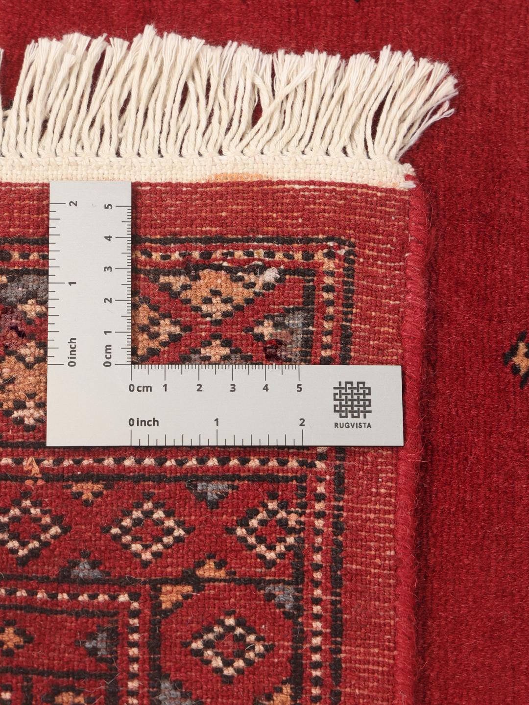 Hand-knotted red Pakistan Bokhara runner rug
