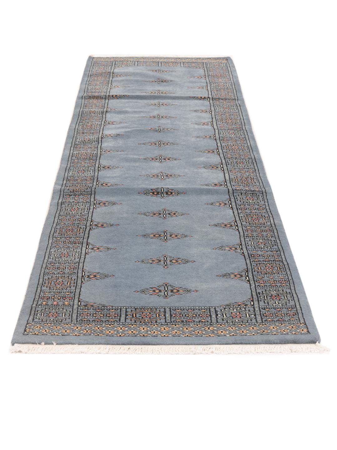 Hand-knotted runner rug from Pakistan in a soft blue colour