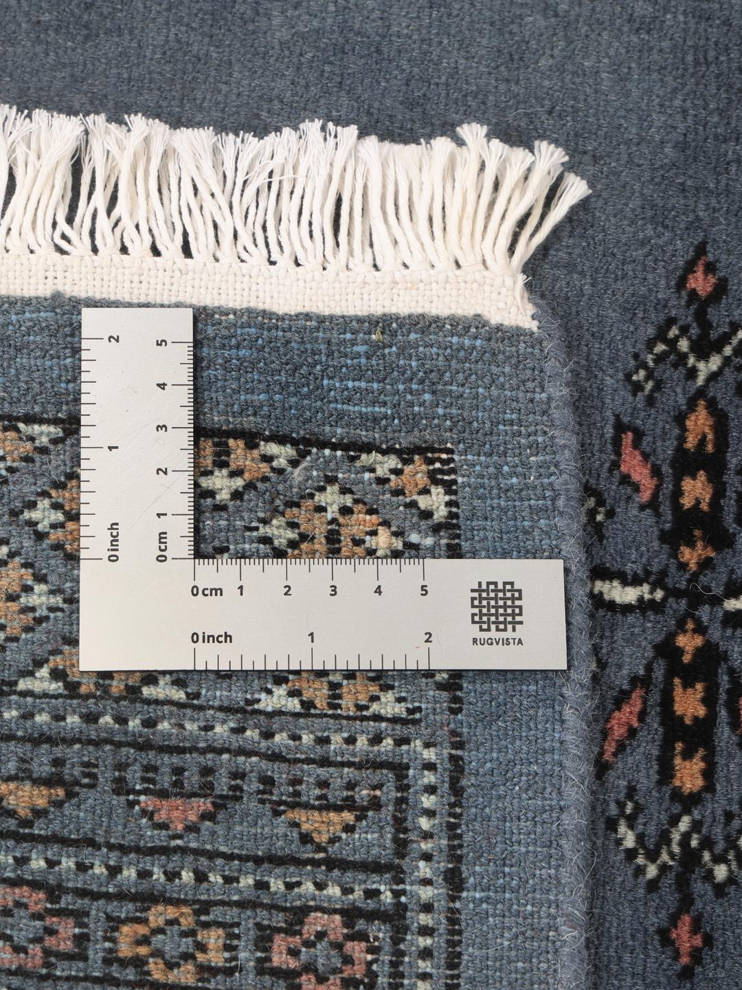 Hand-knotted runner rug from Pakistan in a soft blue colour