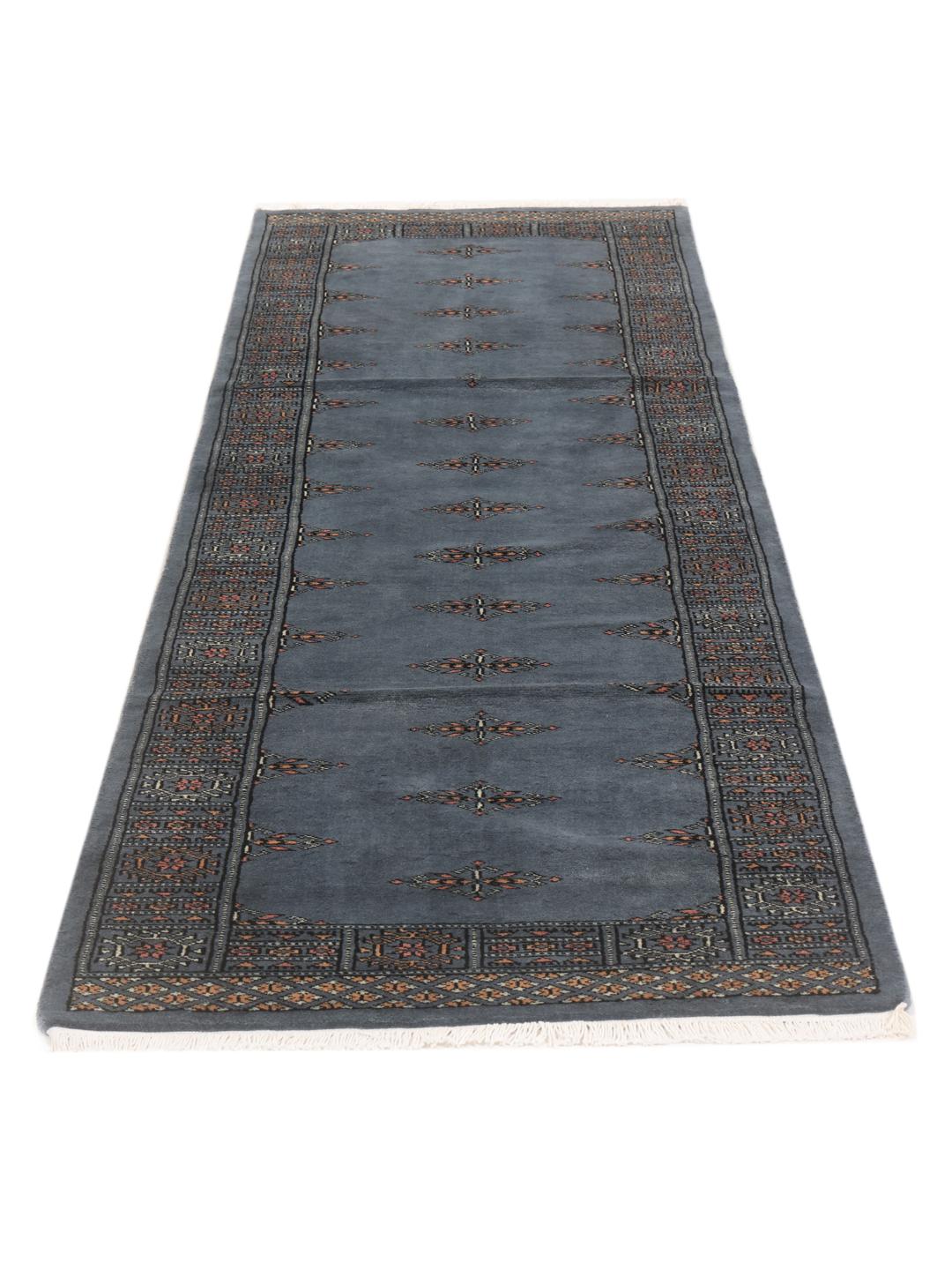 Hand-knotted runner rug from Pakistan in a soft blue colour