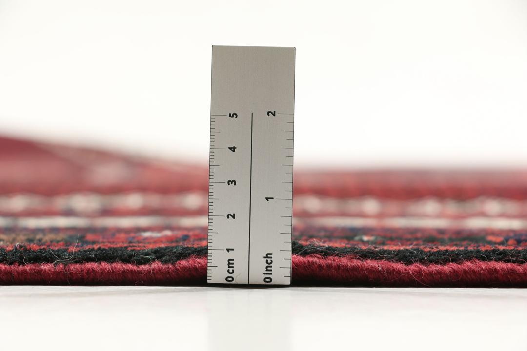 Håndknyttet mørkerødt uldtæppe fra Mellemøsten