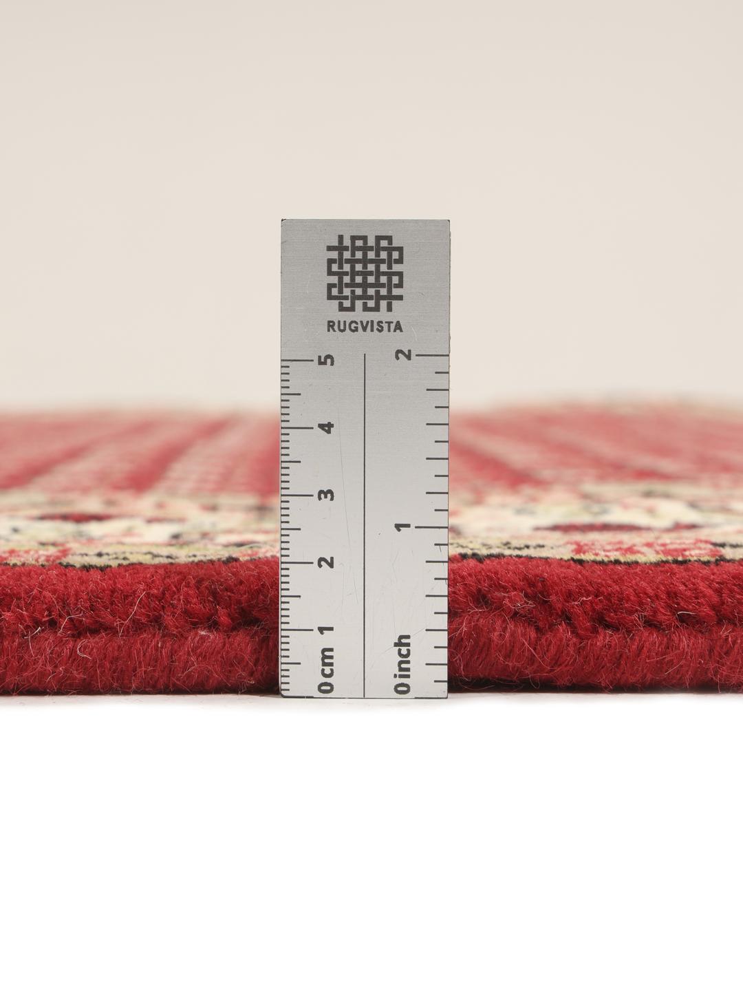 Handgeknoopt rood Mir Indo tapijt met traditionele bloemmotieven uit India.