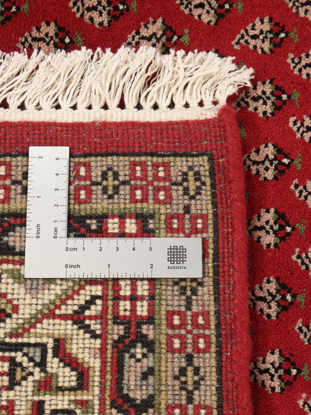Handgeknoopt rood Mir Indo tapijt met traditionele bloemmotieven uit India.