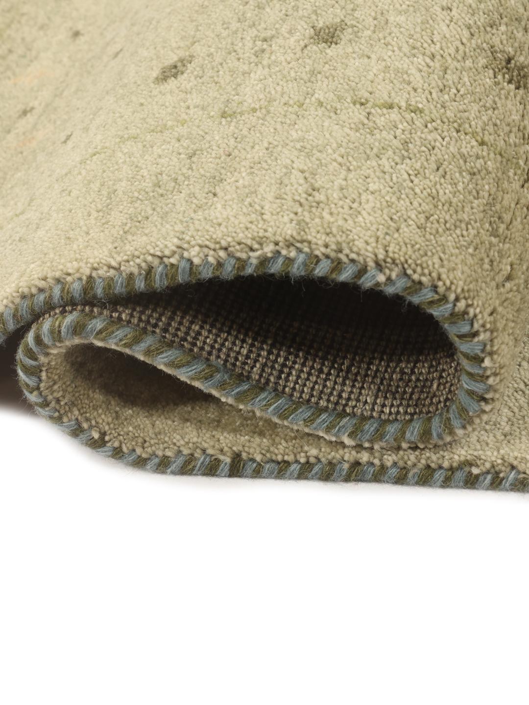 Hand-knotted Gabbeh rug from India in a soft light-green shade