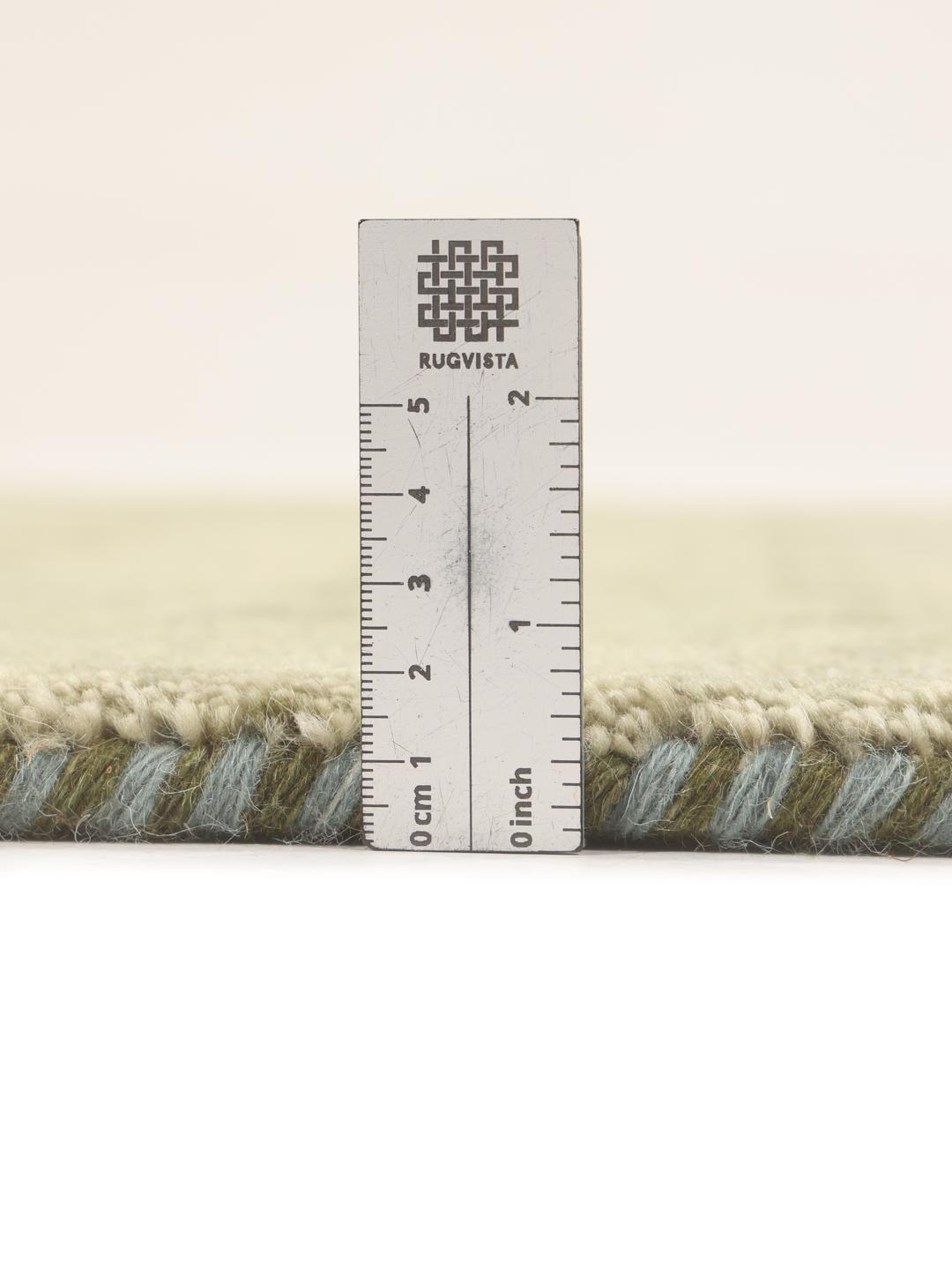 Hand-knotted Gabbeh rug from India in a soft light-green shade