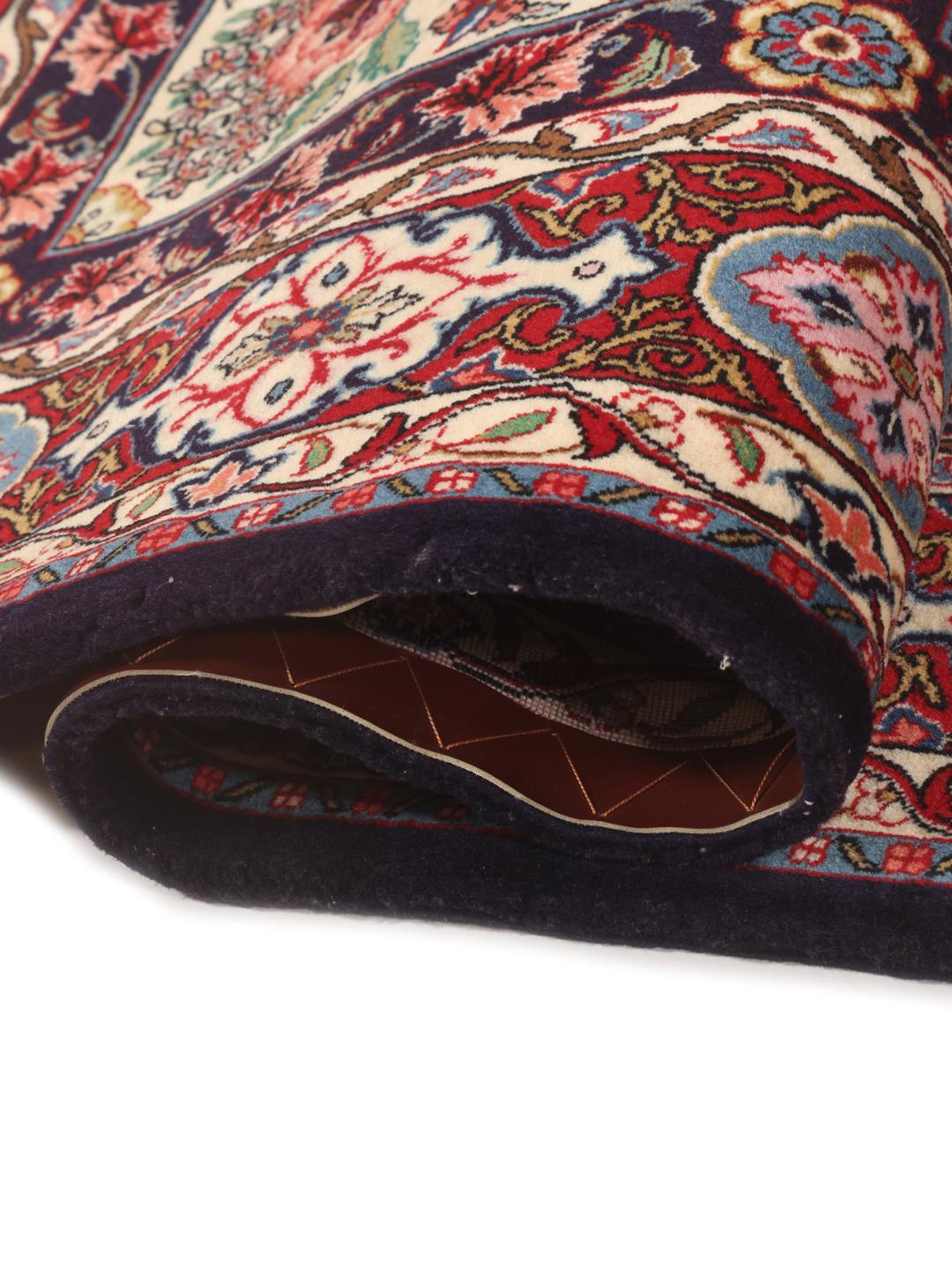 Hand-knotted Sarouk rug from the Middle East in deep red and cream tones