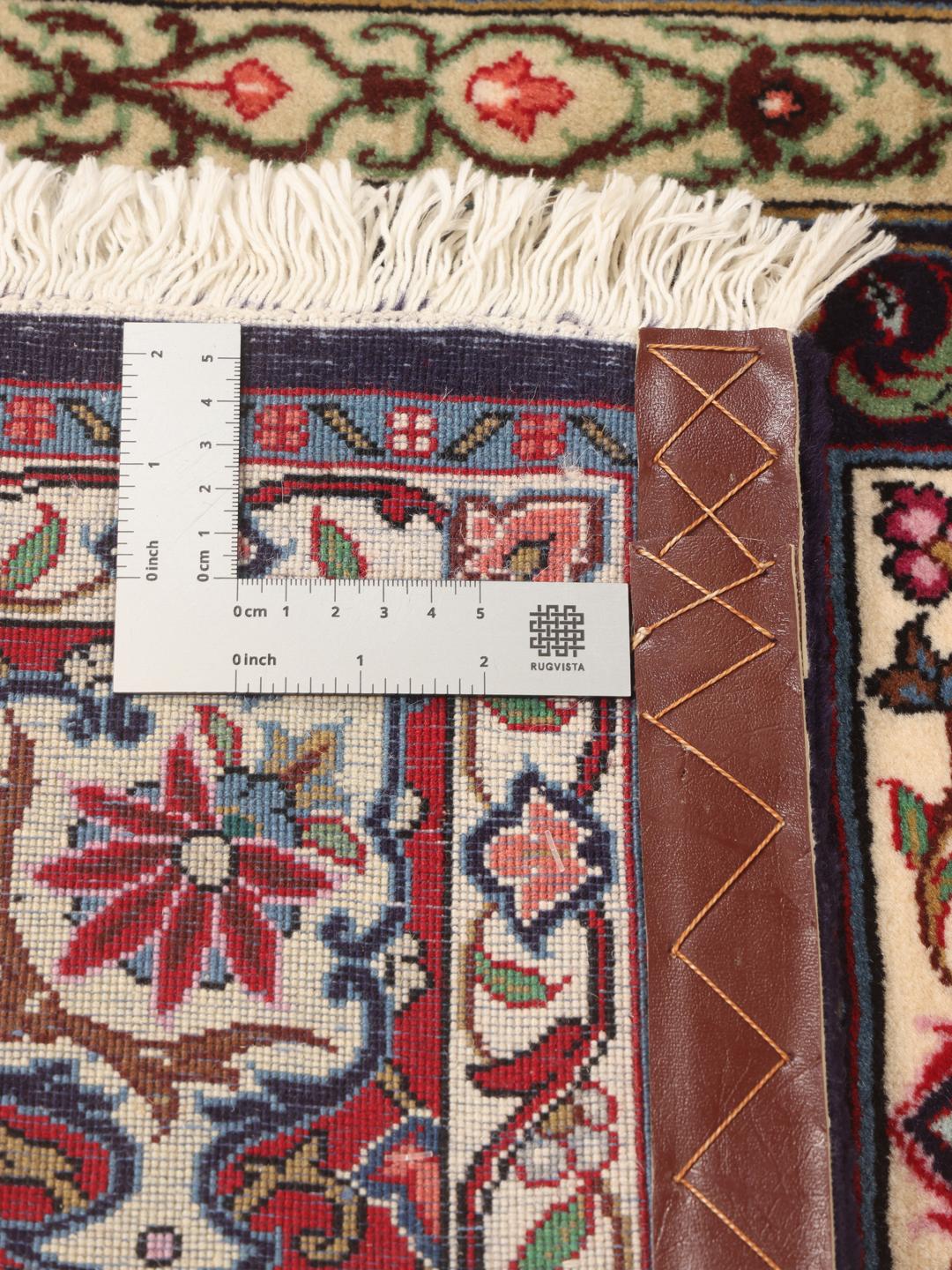 Hand-knotted Sarouk rug from the Middle East in deep red and cream tones