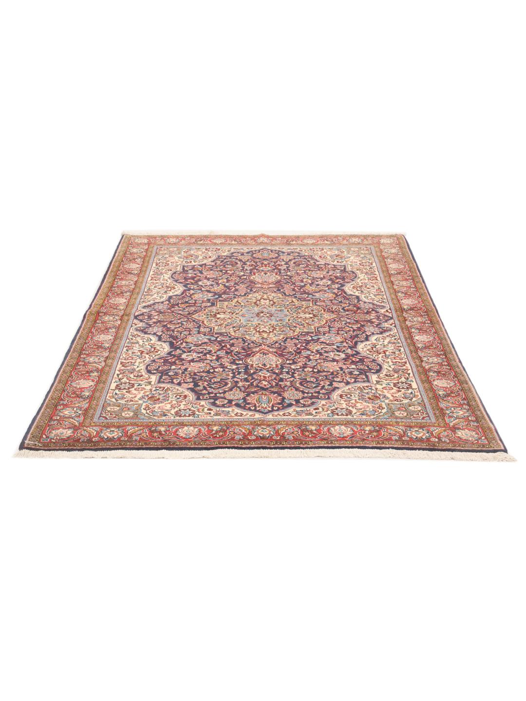 A hand-knotted Sarough rug from the Middle East with a multicolor floral medallion pattern.