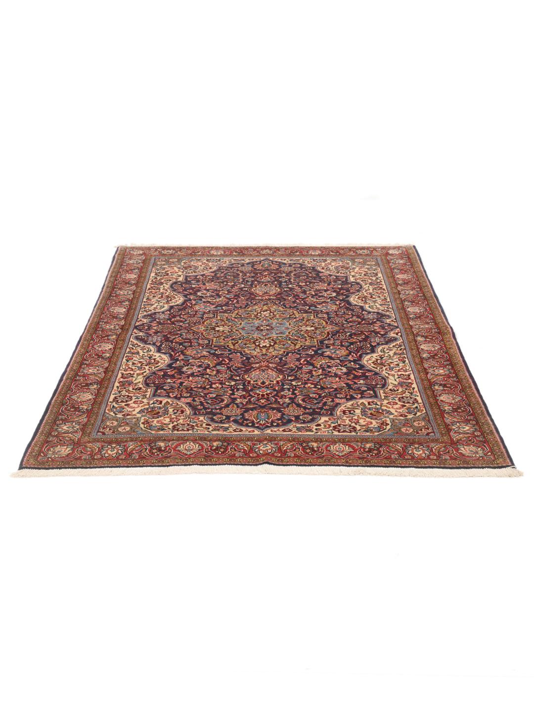 A hand-knotted Sarough rug from the Middle East with a multicolor floral medallion pattern.