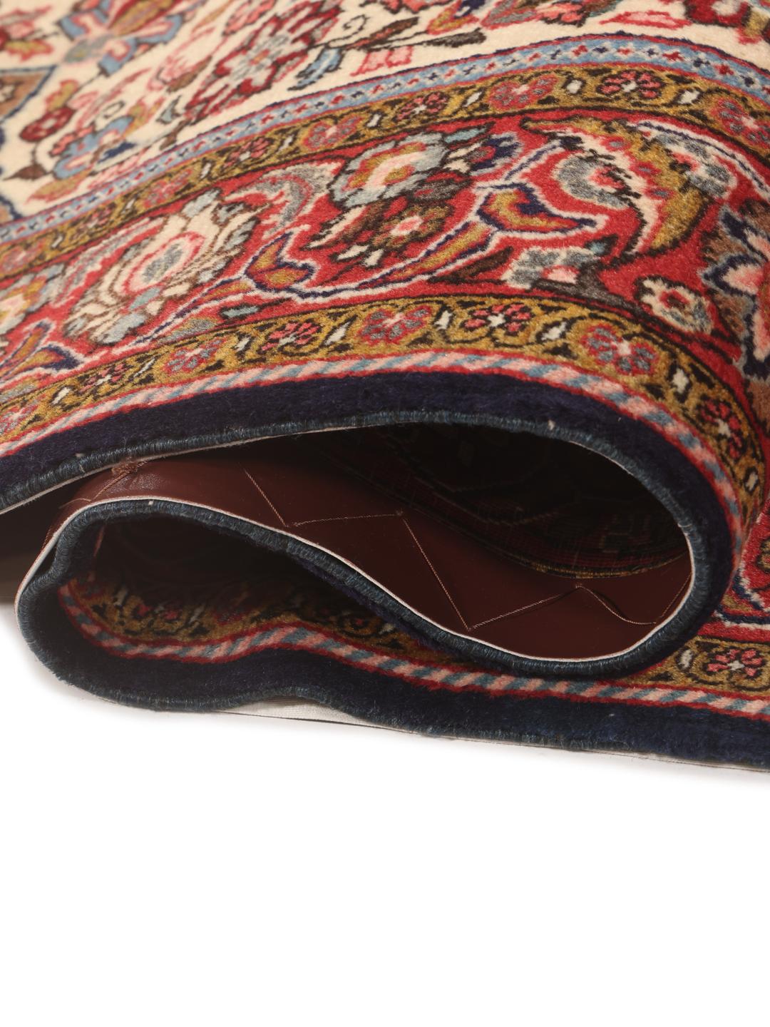 A hand-knotted Sarough rug from the Middle East with a multicolor floral medallion pattern.