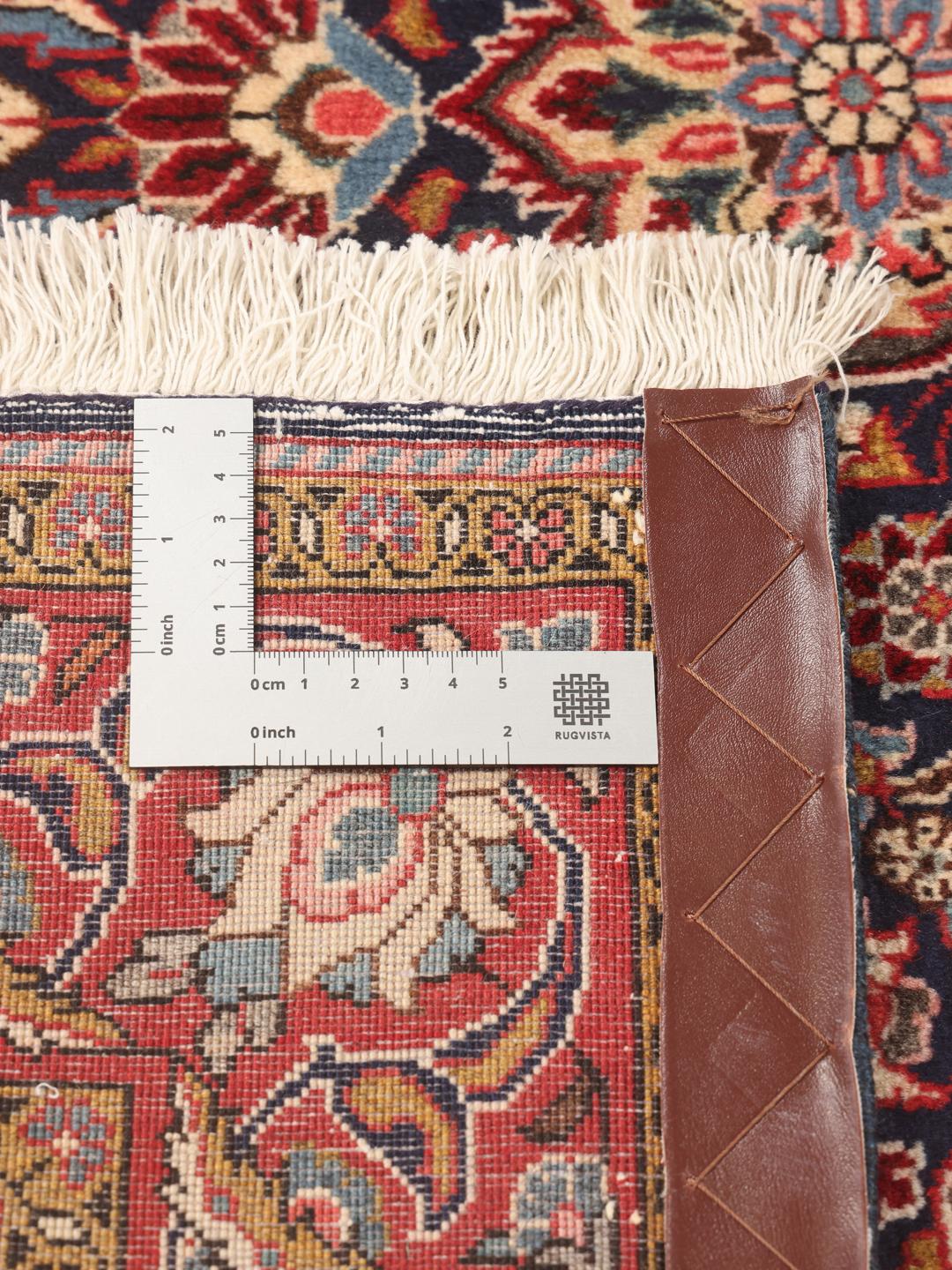 A hand-knotted Sarough rug from the Middle East with a multicolor floral medallion pattern.