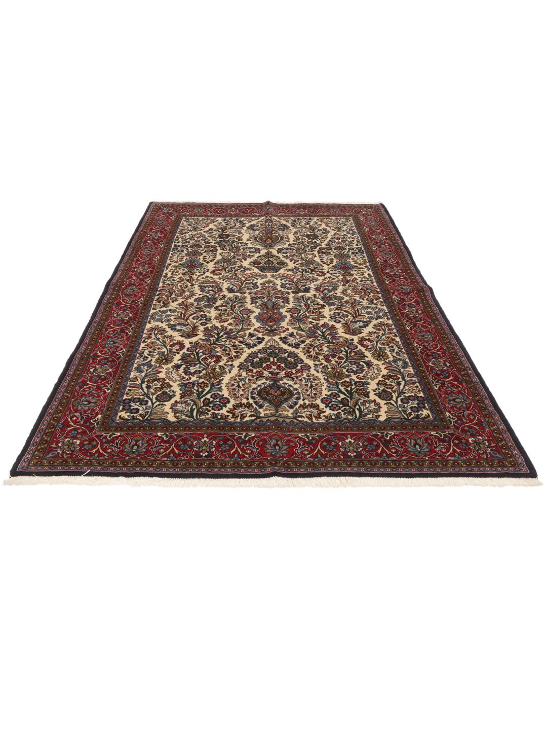 Hand-knotted Sarough rug from the Middle East with a floral pattern in red and beige.