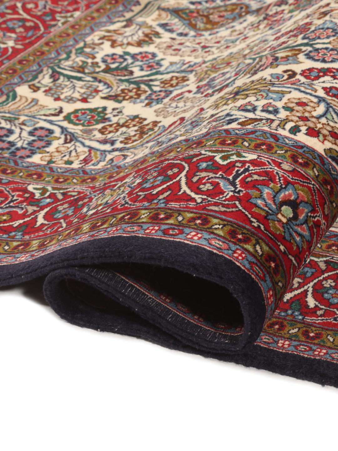 Hand-knotted Sarough rug from the Middle East with a floral pattern in red and beige.