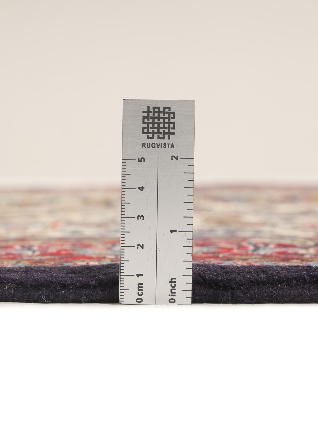 Hand-knotted Sarough rug from the Middle East with a floral pattern in red and beige.