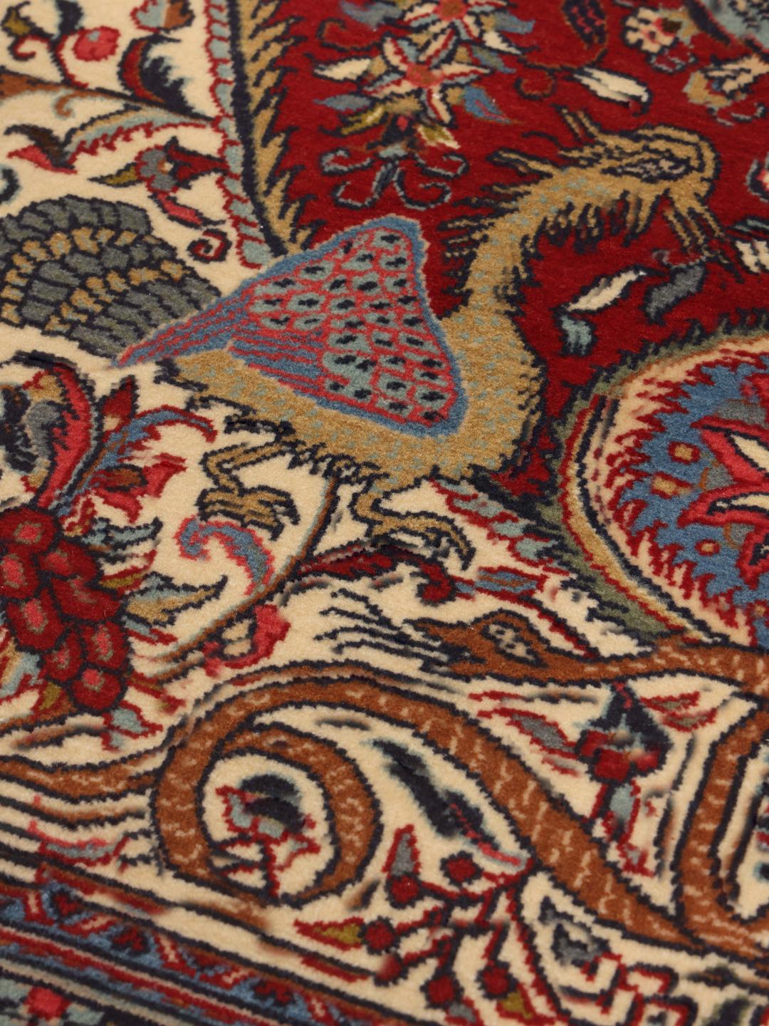 Hand-knotted Sarough rug from the Middle East featuring a vibrant red and blue pictorial floral design