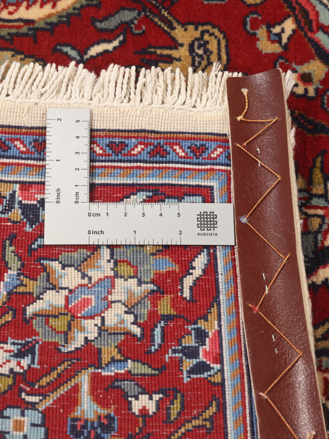 Hand-knotted Sarough rug from the Middle East featuring a vibrant red and blue pictorial floral design
