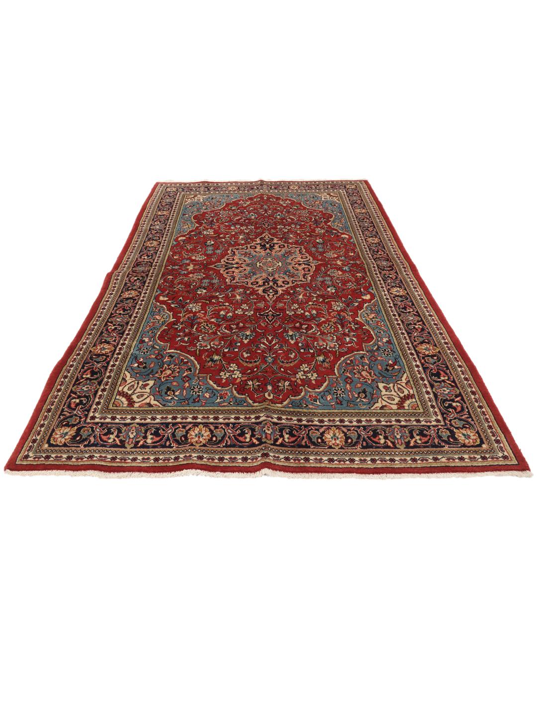 Hand-knotted Sarough rug from the Middle East with a red and blue floral pattern.