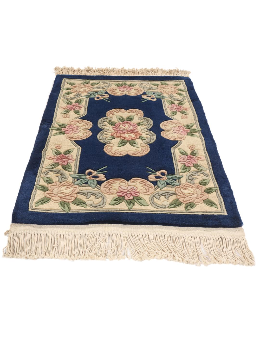 Hand-knotted Chinese rug with floral motifs on a deep blue field
