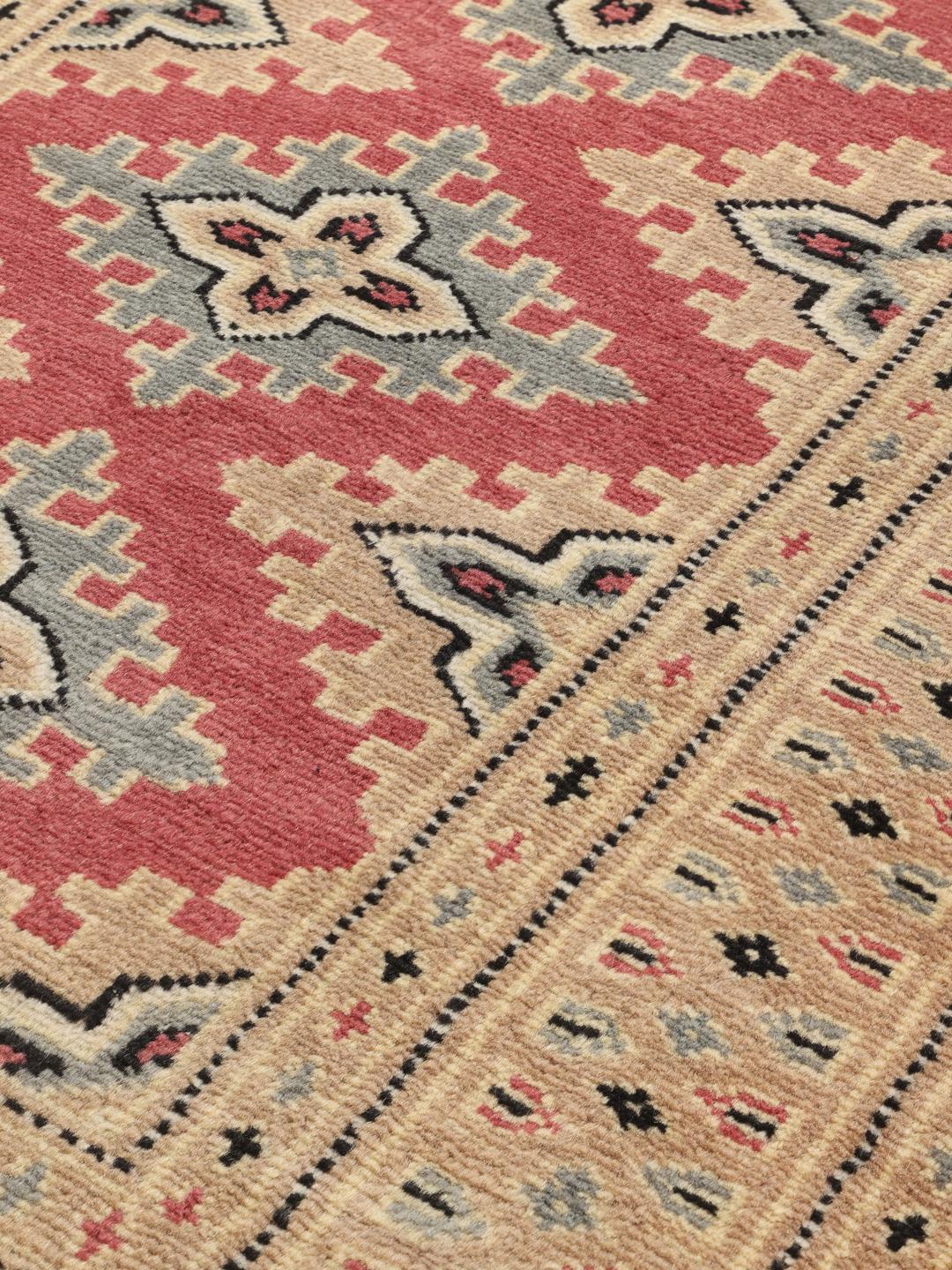 Hand-knotted Pakistan Bokhara rug with red and beige geometric floral patterns