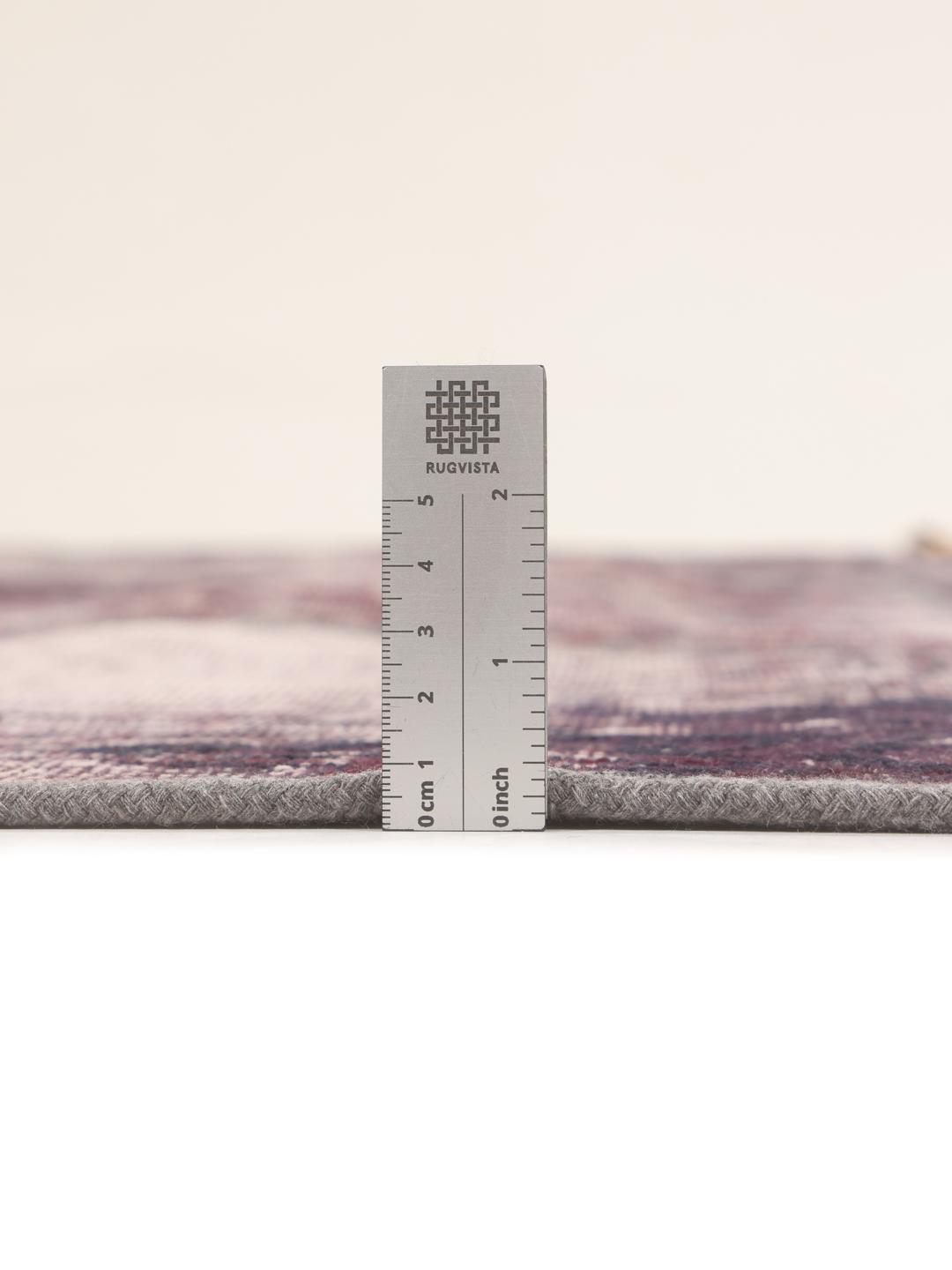 A unique patchwork rug with deep red and dark tones, Middle Eastern origin