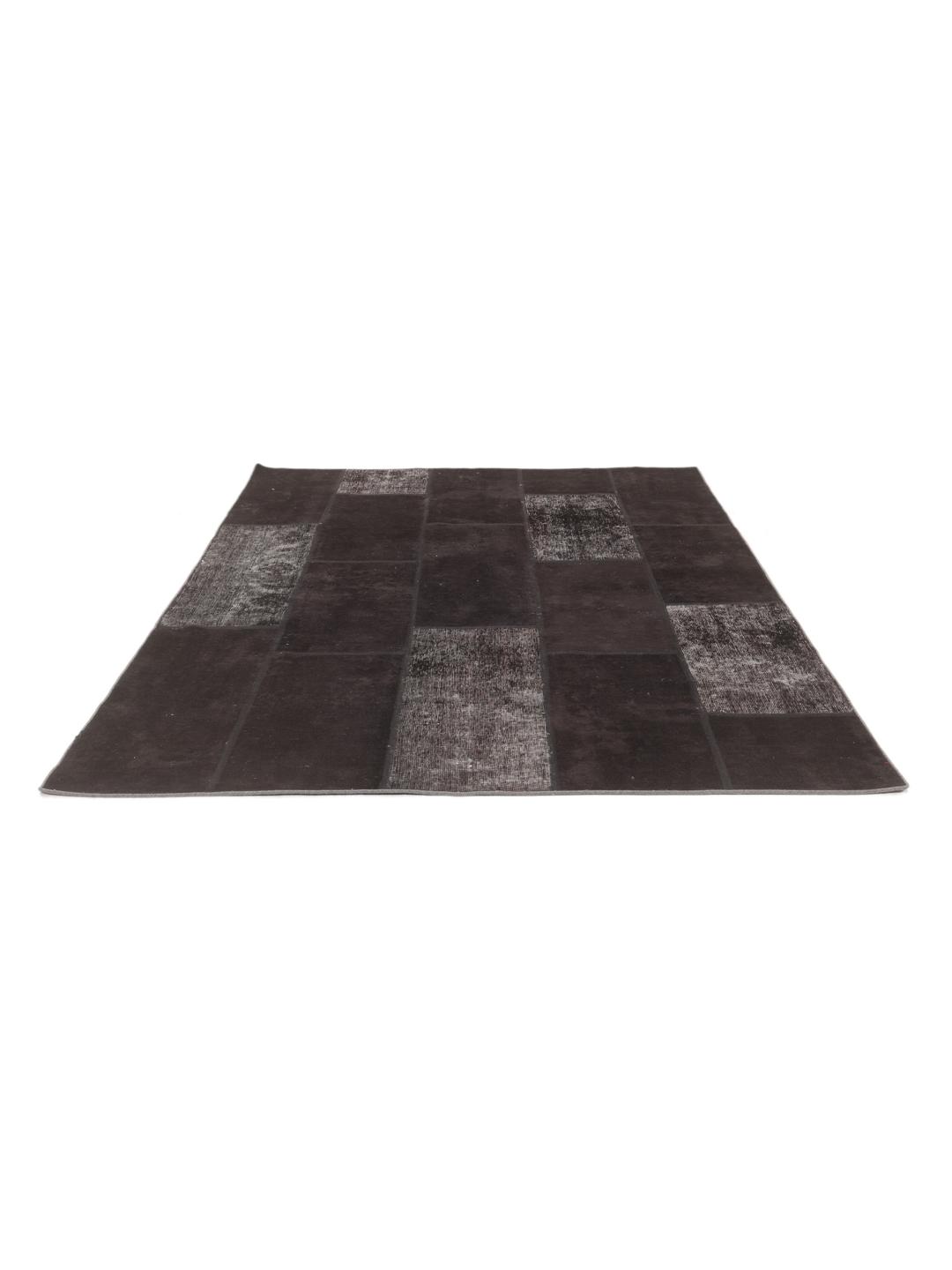 Hand-knotted patchwork rug from the Middle East in black