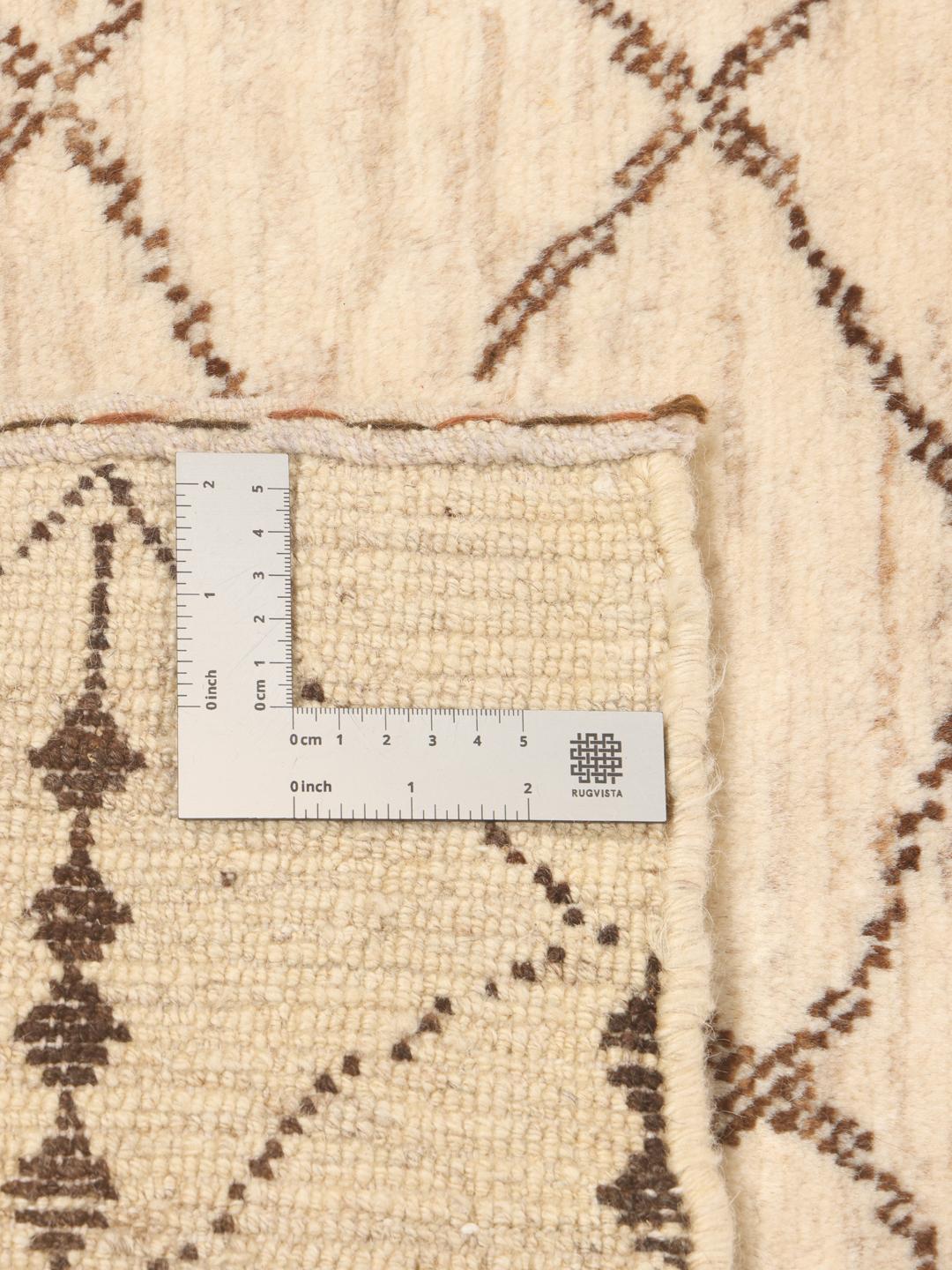 Hand-knotted Gabbeh Fine wool rug with geometric patterns in beige and brown, origin Middle East.