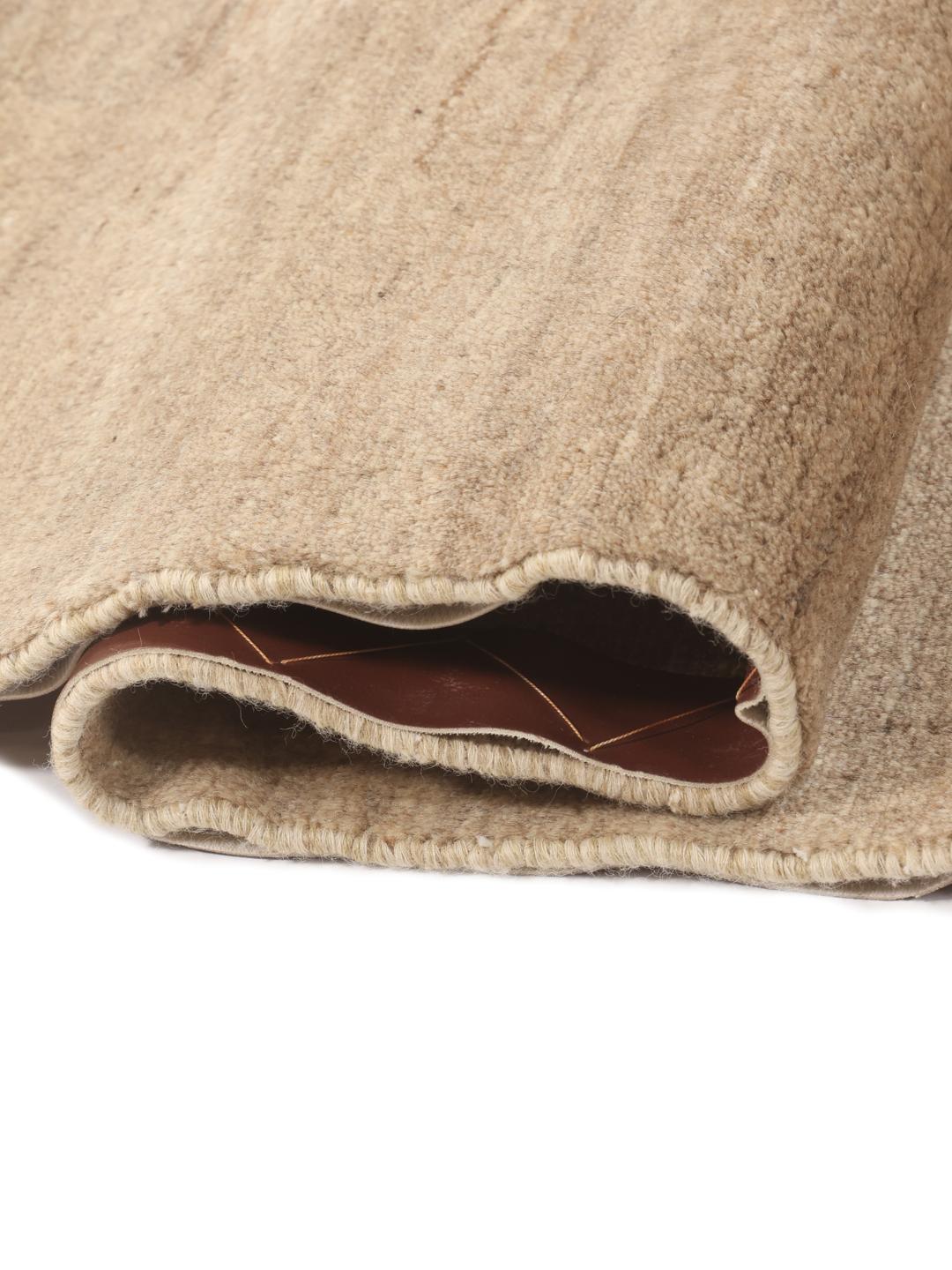 Hand-knotted Gabbeh Fine Wool rug with a geometric pattern in beige tones from the Middle East.