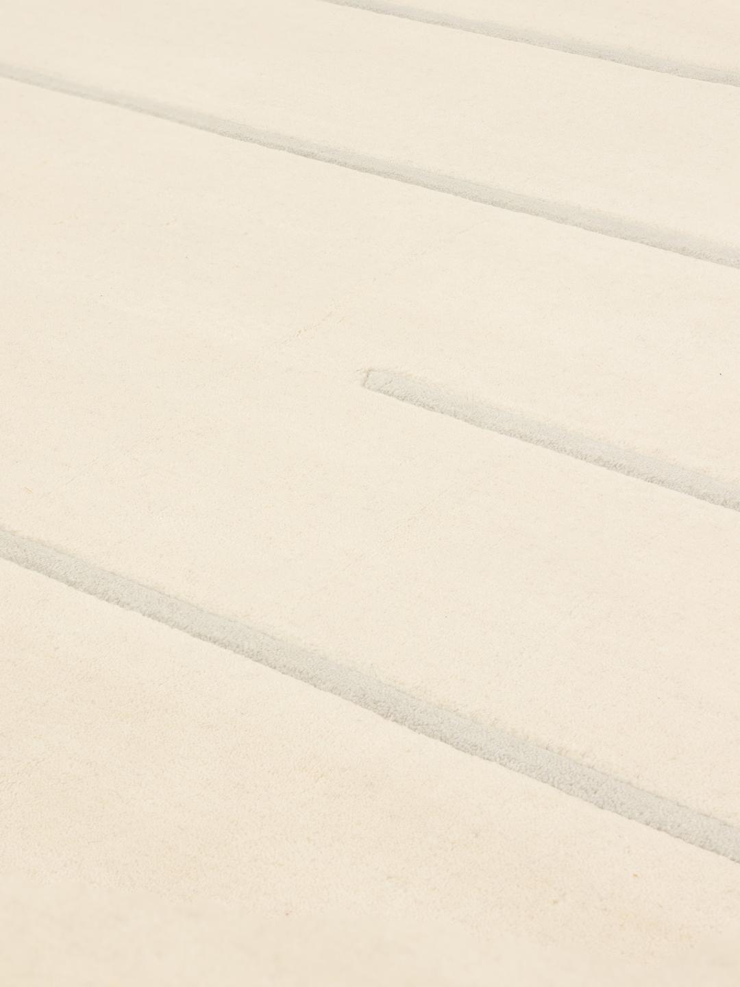 Rundt moderne tæppe fra Indien med et stribet mønster i beige og grå