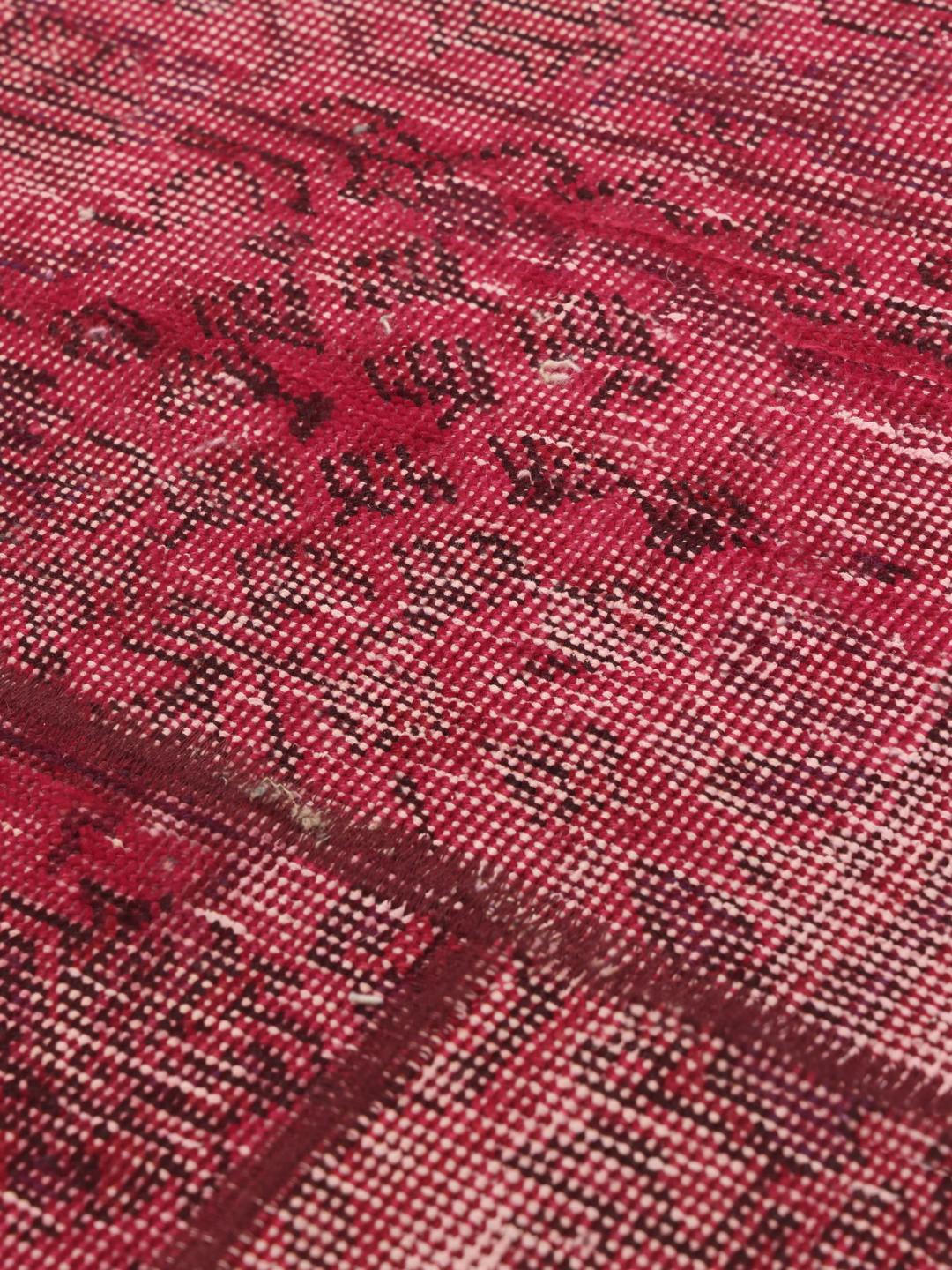 Hand-knotted patchwork rug from the Middle East in vibrant shades of red