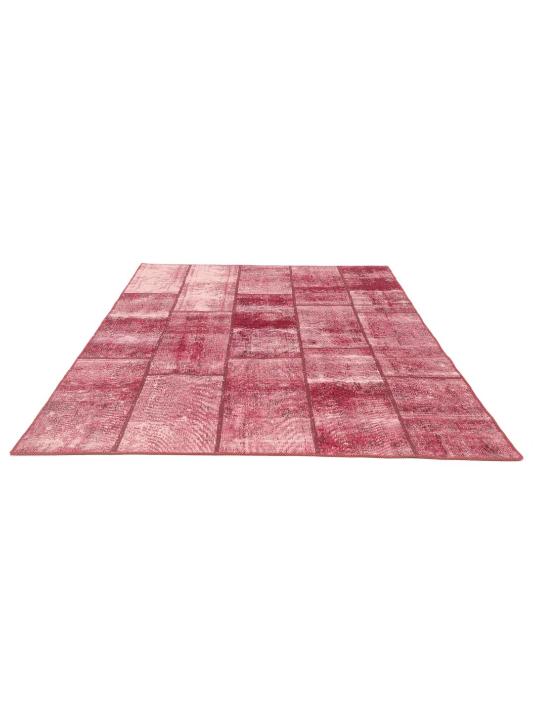 Hand-knotted patchwork rug from the Middle East in vibrant shades of red