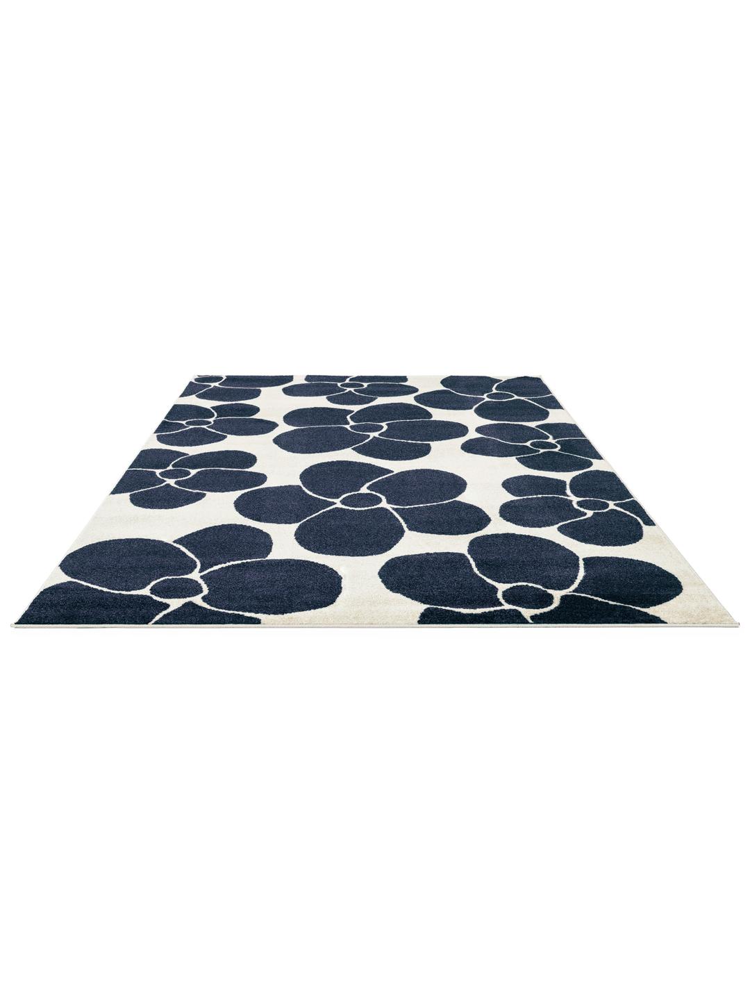 Donkerblauw en wit vloerkleed met bloemenpatroon