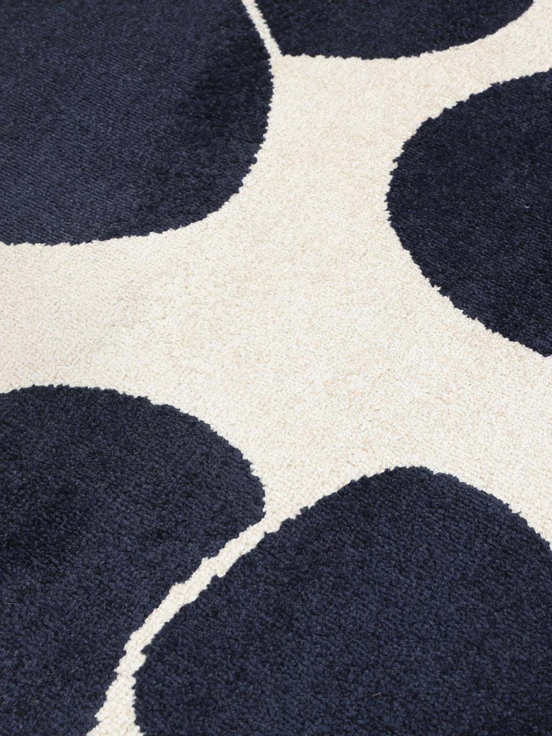 Donkerblauw en wit vloerkleed met bloemenpatroon
