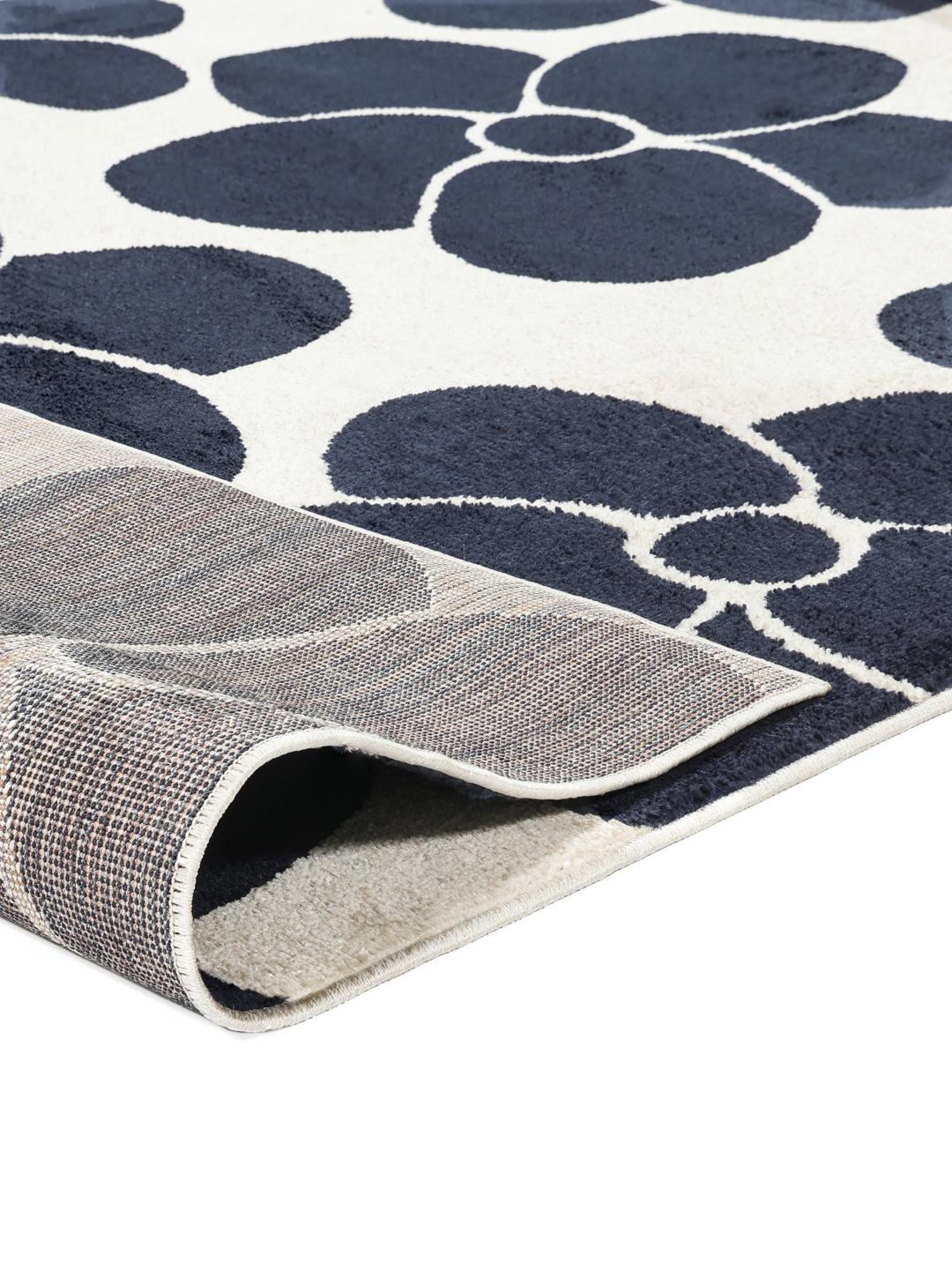 Donkerblauw en wit vloerkleed met bloemenpatroon