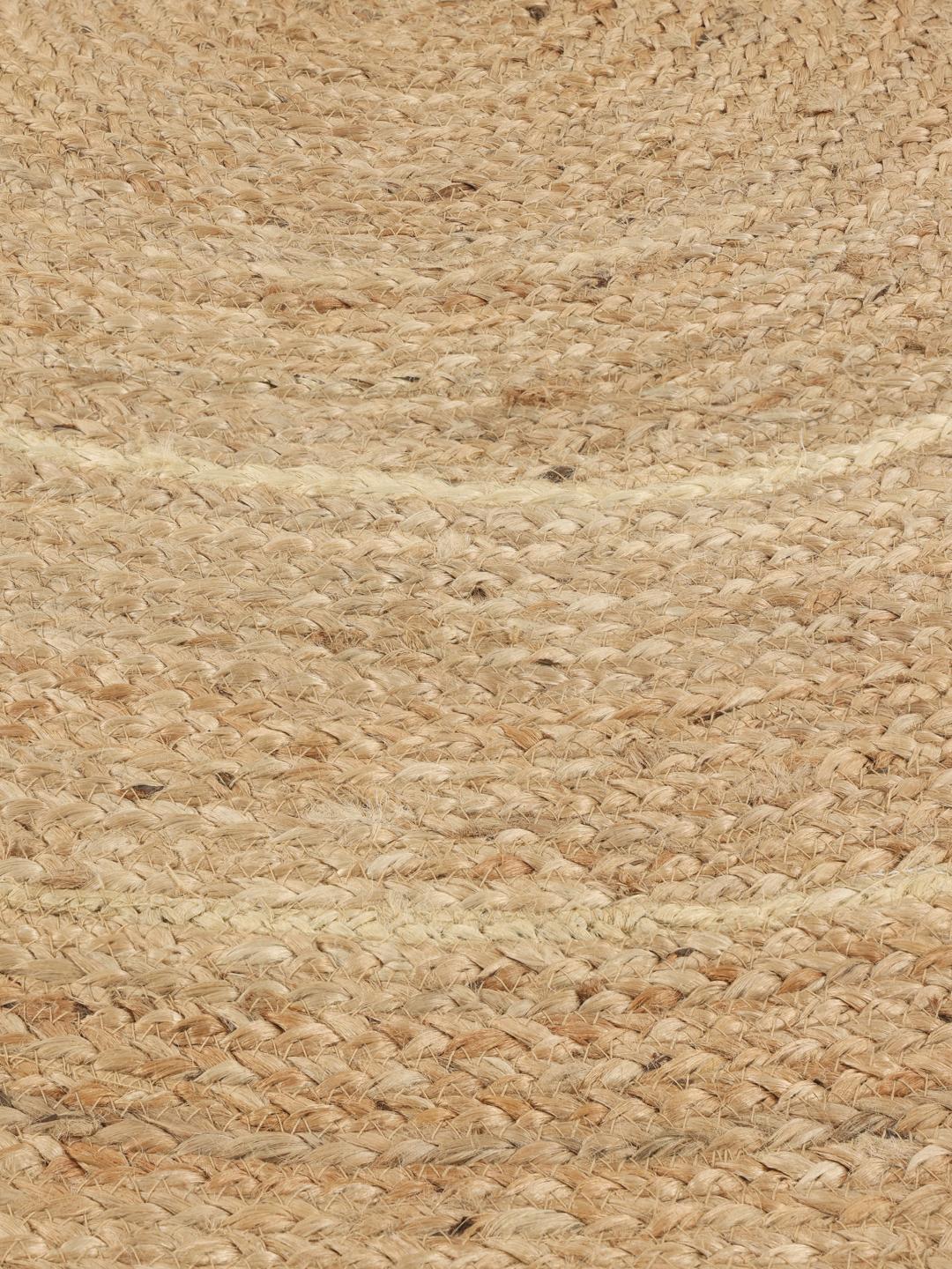 Rond beige jute vloerkleed met een schulprand