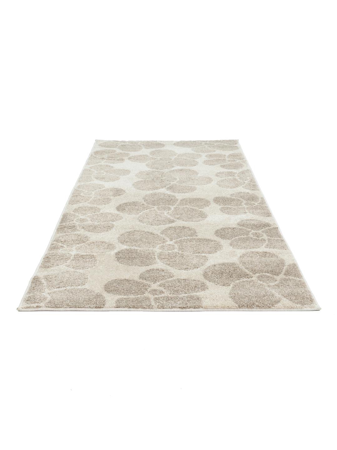 Een beige loper met een herhalend bloemmotief