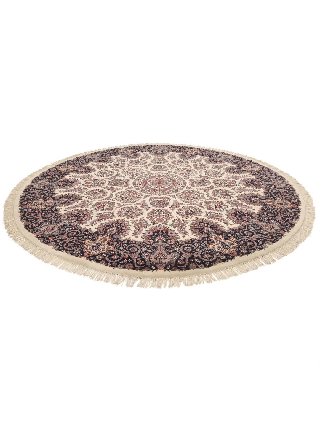 Een rond beige en donkerrood handgeknoopt Sarouk tapijt uit India