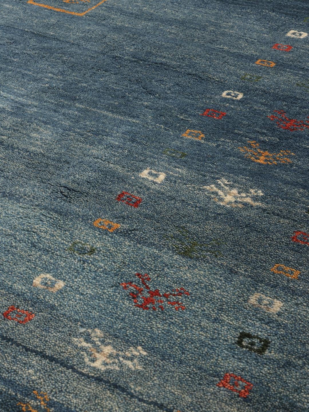 A rectangular hand-knotted Gabbeh Fine rug from the Middle East in deep blue