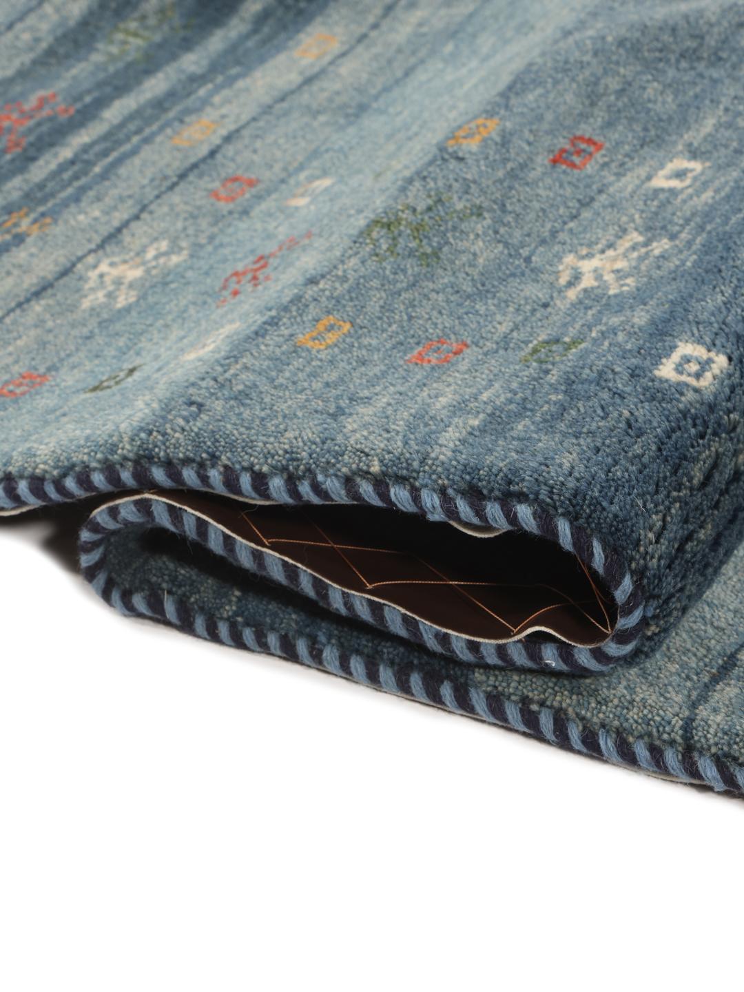 A rectangular hand-knotted Gabbeh Fine rug from the Middle East in deep blue